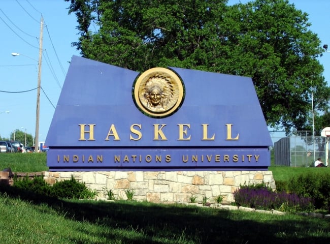 A blue sign reads "Haskell Indian Nations University" in gold letters